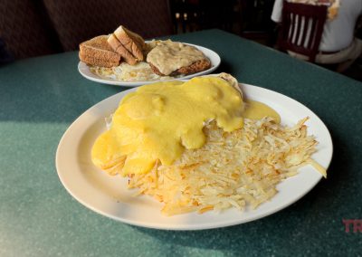 A closeup of tow plates of breakfast food
