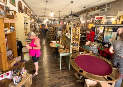 Customers browse a store filled with a wide variety of items