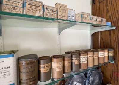 Antique druggist supplies on shelves
