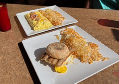 A closeup of two plates of breakfast food on a table