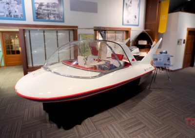 An antique airplane-boat concept vehicle on display in a museum