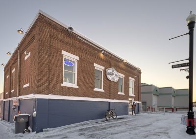 The red brick exterior of Rivers and Rails Brewing in Thief River Falls, MN