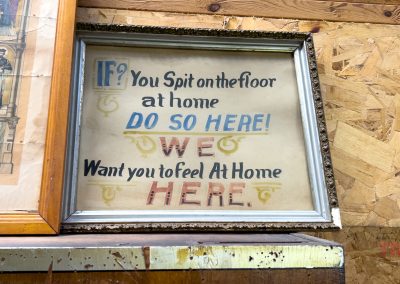A framed sign at the Lucan Historical Society in MN reads, If you spit on the floor at home, do so here!