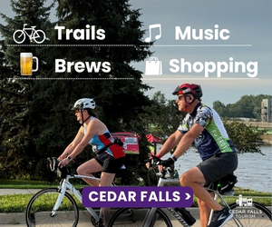 Two cyclists ride on a riverside path with trees and water in the background. Text highlights activities: Trails, Brews, Music, Shopping. A purple button reads Cedar Falls. Cedar Falls tourism logo is in the corner.